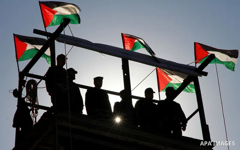 Palestinian members of Hamas security forces stand in formation during a graduation ceremony for new recruits in Gaza City on December 27, 2011. Photo by Ashraf Amra.