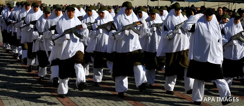 Palestinian Hamas security women march during a graduation ceremony of a military training course of the ministry of interior in Gaza City on 27 December 2011. Photo by Ashraf Amra