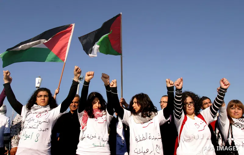 Demonstrators take part in a protest against israeli army in a anniversary of the Israeli war on the Gaza Strip in 2008, in East Jerusalem on Dec. 27, 2011. Photo by Mahfouz Abu Turk
