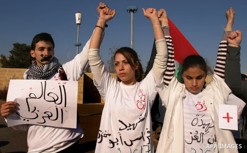Demonstrators take part in a protest against israeli army in a anniversary of the Israeli war on the Gaza Strip in 2008, in East Jerusalem on Dec. 27, 2011. Photo by Mahfouz Abu Turk