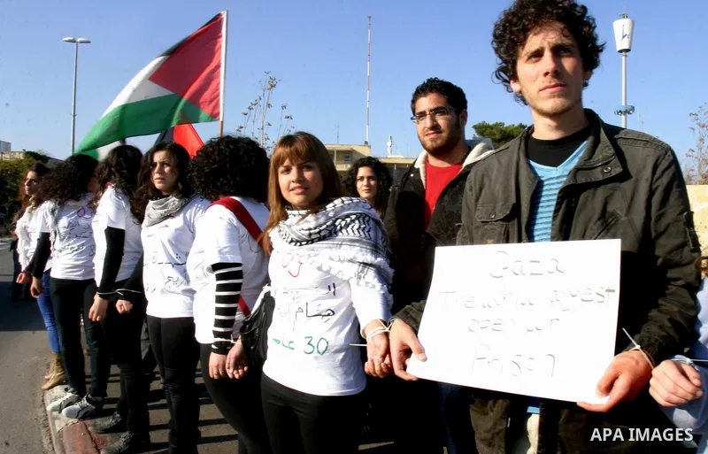 Demonstrators take part in a protest against israeli army in a anniversary of the Israeli war on the Gaza Strip in 2008, in East Jerusalem on Dec. 27, 2011. Photo by Mahfouz Abu Turk