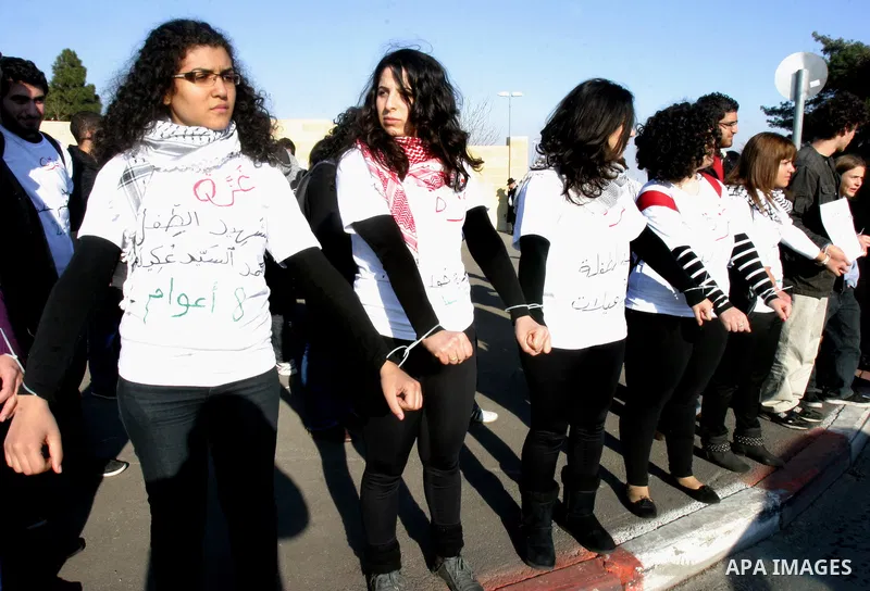 Demonstrators take part in a protest against israeli army in a anniversary of the Israeli war on the Gaza Strip in 2008, in East Jerusalem on Dec. 27, 2011. Photo by Mahfouz Abu Turk