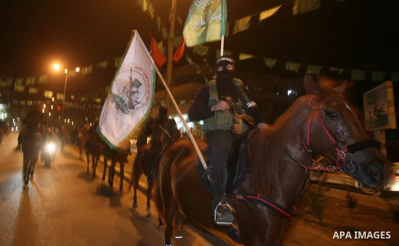 Hamas militant take part in a parade to mark the third anniversary of the Israeli offensive on the Gaza Strip, in Gaza City on December 27, 2011.. Photo by Mahmud Nassar