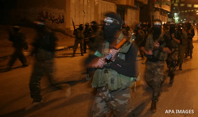 Hamas militant take part in a parade to mark the third anniversary of the Israeli offensive on the Gaza Strip, in Gaza City on December 27, 2011.. Photo by Mahmud Nassar