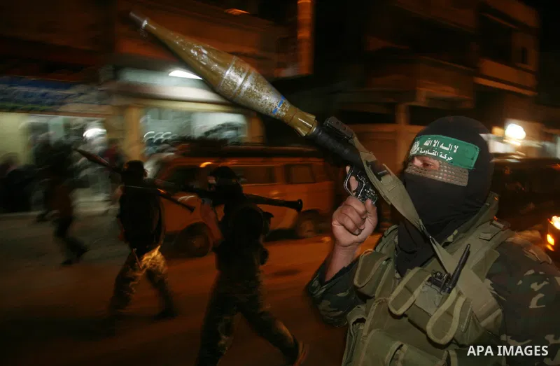 Hamas militant take part in a parade to mark the third anniversary of the Israeli offensive on the Gaza Strip, in Gaza City on December 27, 2011.. Photo by Mahmud Nassar