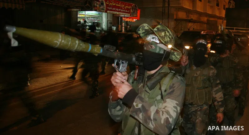 Hamas militant take part in a parade to mark the third anniversary of the Israeli offensive on the Gaza Strip, in Gaza City on December 27, 2011.. Photo by Mahmud Nassar