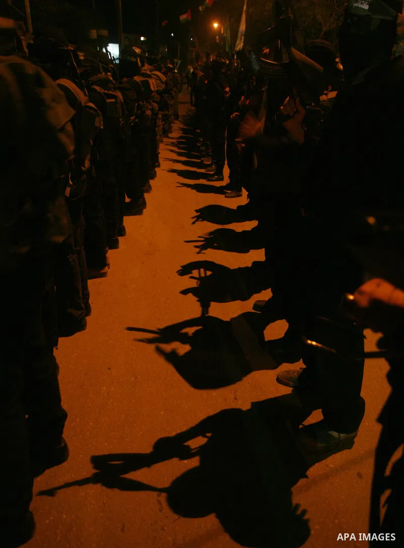 Hamas militant take part in a parade to mark the third anniversary of the Israeli offensive on the Gaza Strip, in Gaza City on December 27, 2011.. Photo by Mahmud Nassar