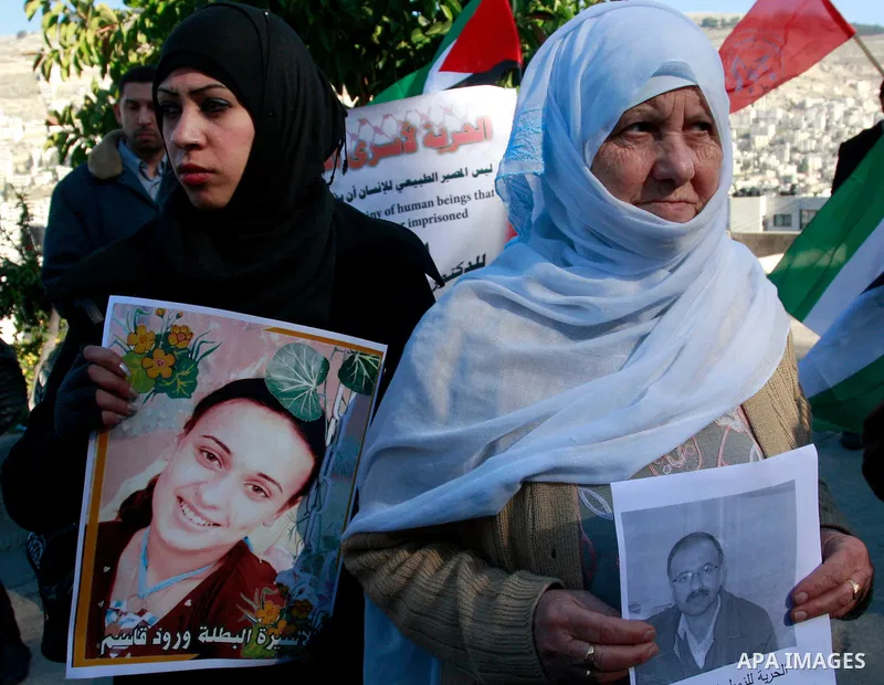 Palestinians participate in a demonstration in solidarity with prisoners jailed in Israel, in the West Bank city of Nablus, Wednesday ,Dec. 28, 2011. Photo by Wagdi Eshtayah.