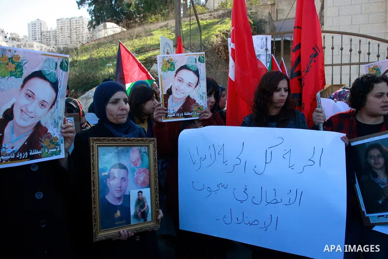 Palestinians participate in a demonstration in solidarity with prisoners jailed in Israel, in the West Bank city of Nablus, Wednesday ,Dec. 28, 2011. Photo by Wagdi Eshtayah.