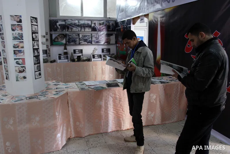 Palestinians, take parts during the opening of gallery of the palestinian police Contains Israeli equipment, in Gaza City, on Dec. 29, 2011. Photo by Mohammed Asad