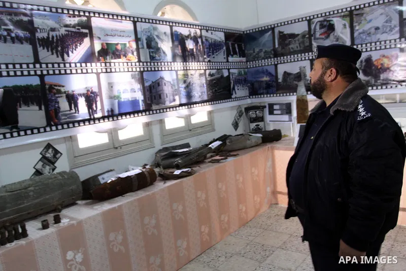Palestinian member of Hamas, take parts during the opening of gallery of the palestinian police Contains Israeli equipment, in Gaza City, on Dec. 29, 2011. Photo by Mohammed Asad