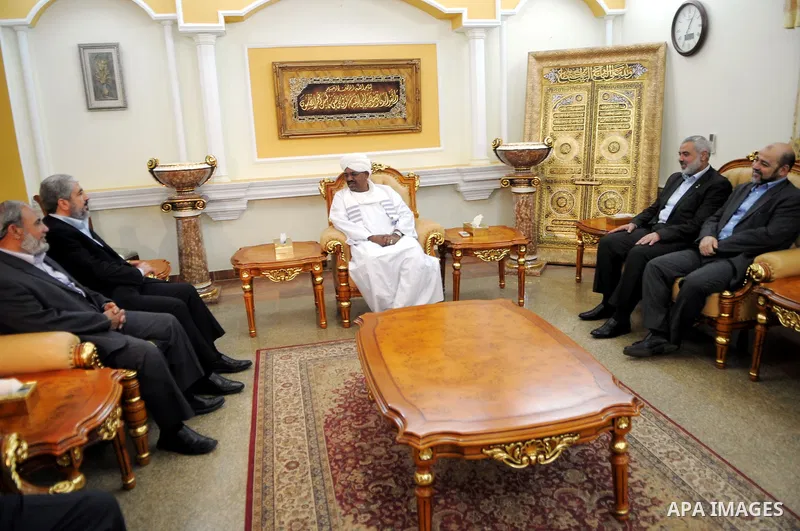Sudanese President Omar al-Beshir meets with Palestinian Prime Minister in gaza, Ismail Haniyeh, and Hamas politburo chief, Khaled Meshaal in the Sudan's capital of Al-Khartoum on December 28, 2011. Photo by Mohamad Osta...