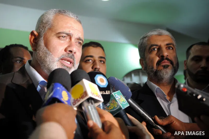 Sudanese President Omar al-Beshir meets with Palestinian Prime Minister in gaza, Ismail Haniyeh, and Hamas politburo chief, Khaled Meshaal in the Sudan's capital of Al-Khartoum on December 28, 2011. Photo by Mohamad Osta...