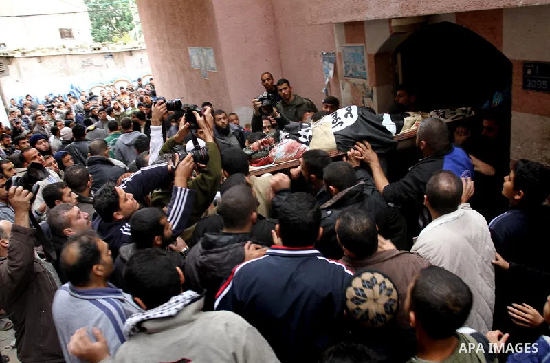 Palestinians carry the body of militant Momen Abu Daf during his funeral in Gaza City December 30, 2011. Israel killed the leader of an al Qaeda-inspired faction in the Gaza Strip on Friday, accusing him of involvement i...