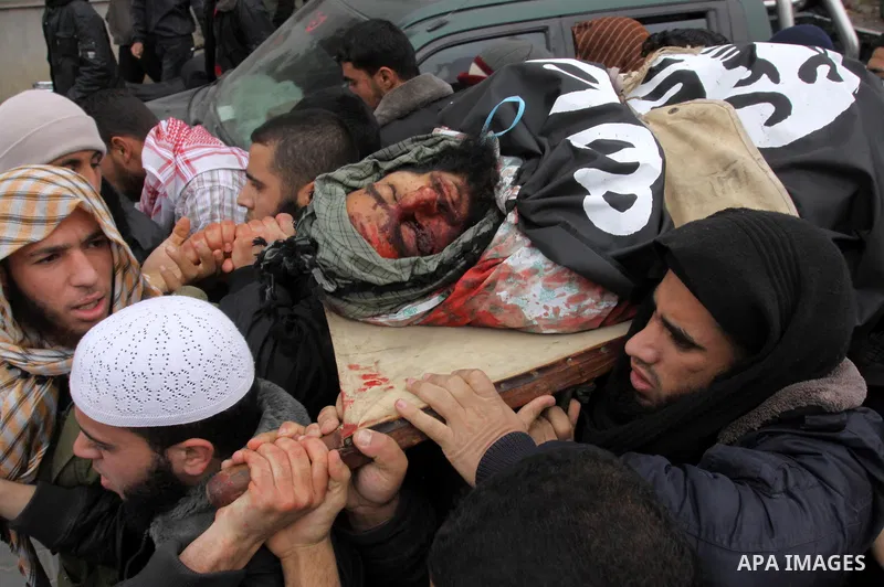 Palestinians carry the body of militant Momen Abu Daf during his funeral in Gaza City December 30, 2011. Israel killed the leader of an al Qaeda-inspired faction in the Gaza Strip on Friday, accusing him of involvement i...