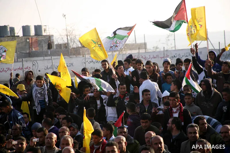 Palestinians during a celebration to to mark the 47th anniversary of the Fatah political movement. in the West Bank city of Hebron.Saturday, Dec. 31, 2011. Photo by Mamoun Wazwaz