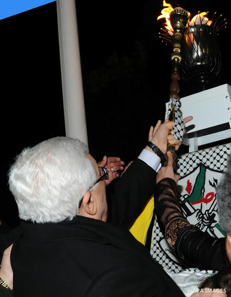 Palestinian president Mahmoud Abbas lights a flame to mark the 47th anniversary of Palestinian revolution and the establishing of Fatah movement, in the West Bank city of Ramallah on December 31, 2011. Photo by Mufeed Ab...