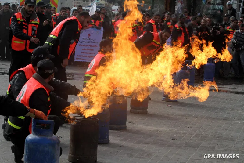 Members of the Palestinian Civil defence demonstrate their skills during a training session following the campaign "your safty" in Gaza City, on Jan. 04, 2012. Photo by Mohammed Asad