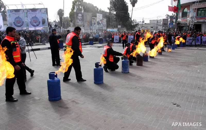 Members of the Palestinian Civil defence demonstrate their skills during a training session following the campaign "your safty" in Gaza City, on Jan. 04, 2012. Photo by Mohammed Asad