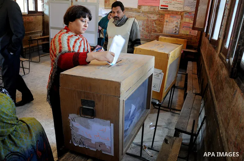 An Egyptian woman casts his vote at a polling center during the second day of the third round of the elections for Egypt's parliament, in Egypt, Wednesday, Jan. 4, 2012. Egyptians are voting in the final round of electio...