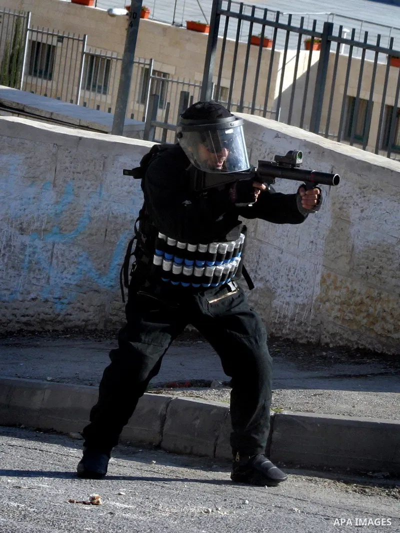 Israeli police officers clashes with Palestinian youths during the visit of Jerusalem Mayor Nir Barkat, not pictured, in the Issawiya neighborhood in east Jerusalem, Wednesday, Jan. 4, 2012. Minor clashes erupted Wednesd...