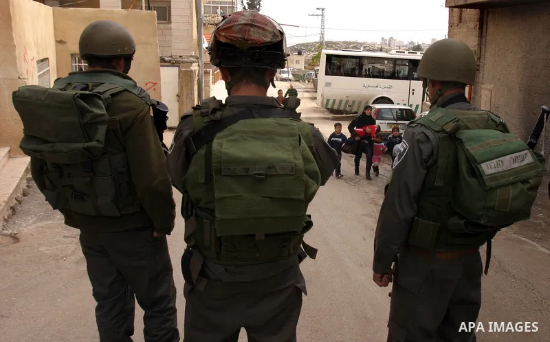 Israeli police officers clashes with Palestinian youths during the visit of Jerusalem Mayor Nir Barkat, not pictured, in the Issawiya neighborhood in east Jerusalem, Wednesday, Jan. 4, 2012. Minor clashes erupted Wednesd...
