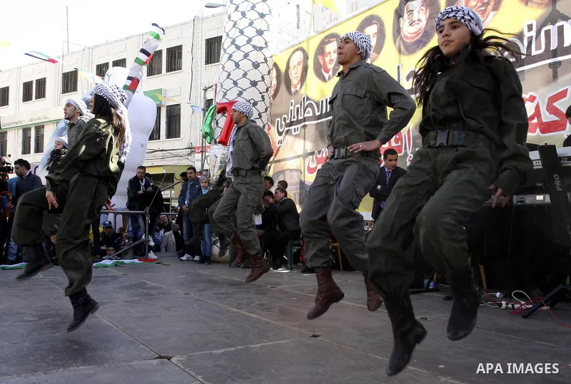 Palestinians celebrate the 47th anniversary of the establishment of the Fatah party, in the West Bank city of Nablus on January 5, 2012. Photo by Wagdi Eshtayah