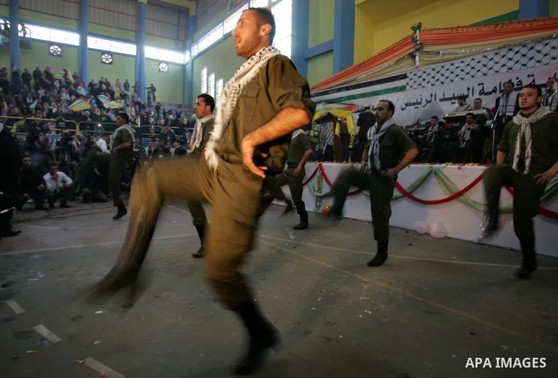 Palestinians celebrate during a mass wedding organized by the Fatah movement for around 40 released Palestinian prisoners in Rafah refugee camp in the southern Gaza Strip on January 5, 2012. Photo by Abed Rahim Khatib