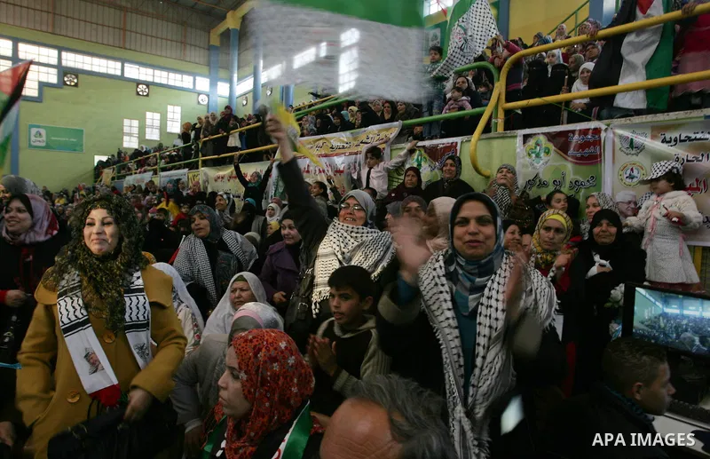 Palestinians celebrate during a mass wedding organized by the Fatah movement for around 40 released Palestinian prisoners in Rafah refugee camp in the southern Gaza Strip on January 5, 2012. Photo by Abed Rahim Khatib