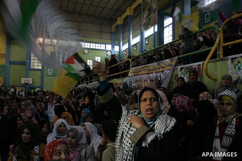 Palestinians celebrate during a mass wedding organized by the Fatah movement for around 40 released Palestinian prisoners in Rafah refugee camp in the southern Gaza Strip on January 5, 2012. Photo by Abed Rahim Khatib