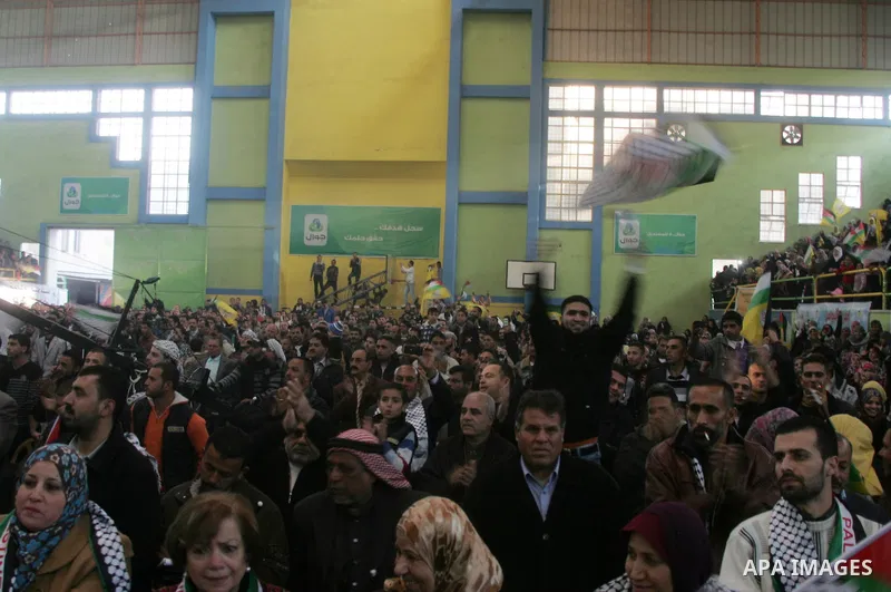Palestinians celebrate during a mass wedding organized by the Fatah movement for around 40 released Palestinian prisoners in Rafah refugee camp in the southern Gaza Strip on January 5, 2012. Photo by Abed Rahim Khatib