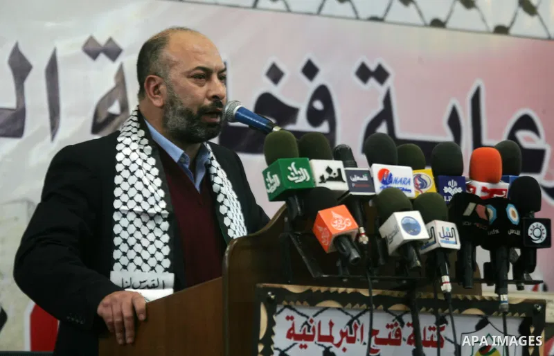 Member of Fatah movement, Ashraf Jomaa, speak during a mass wedding organized by the Fatah movement for around 40 released Palestinian prisoners in Rafah refugee camp in the southern Gaza Strip on January 5, 2012. Photo...