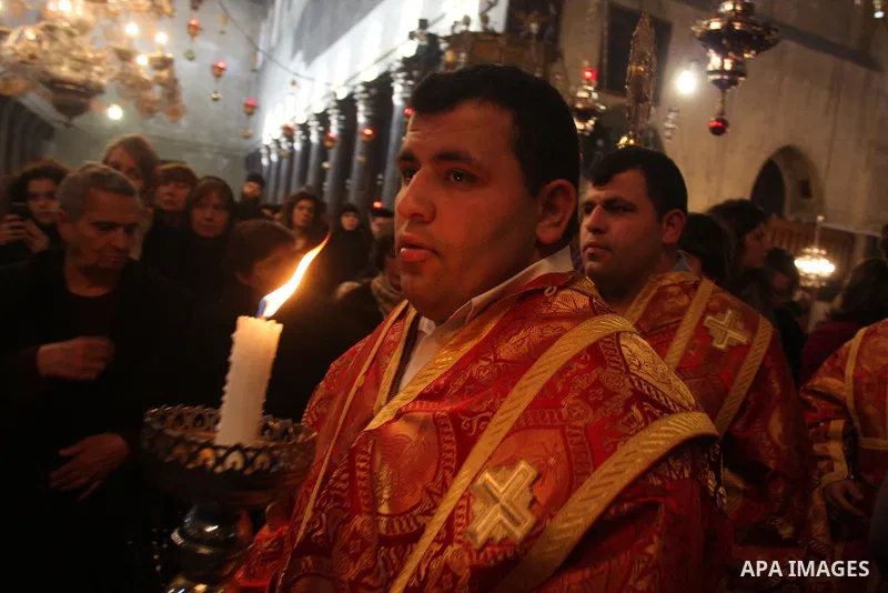 Greek Orthodox priests attend the Christmas procession inside the Church of the Nativity in the West Bank town of Bethlehem January 6, 2012. Photo by Issam Rimawi