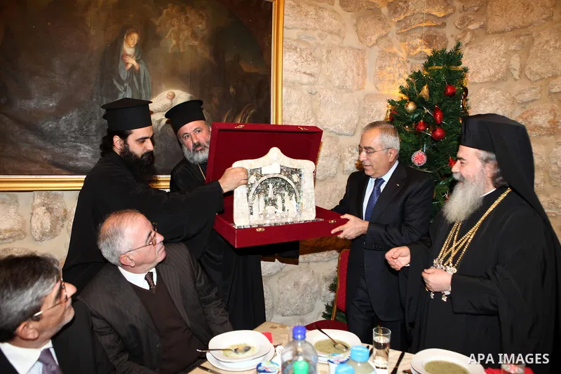 Palestinian Prime Minister Salam Fayyad Participate in the " Gala dinner" the Christmas procession inside the Church of the Nativity in the West Bank town of Bethlehem January 6, 2012. Photo by Mustafa Abu Dayeh