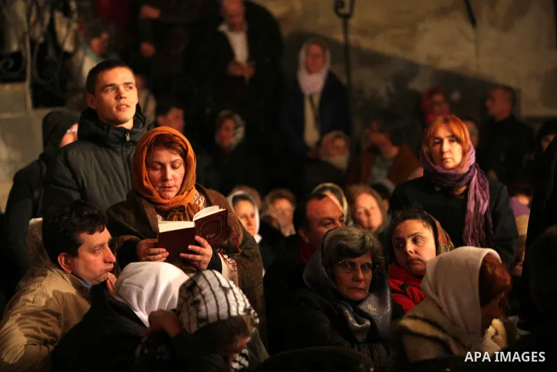 An Orthodox worshipper cries inside the Church of the Nativity, traditionally believed by Christians to be the birthplace of Jesus Christ, during Orthodox Christmas celebrations in the West Bank city of Bethlehem, late F...