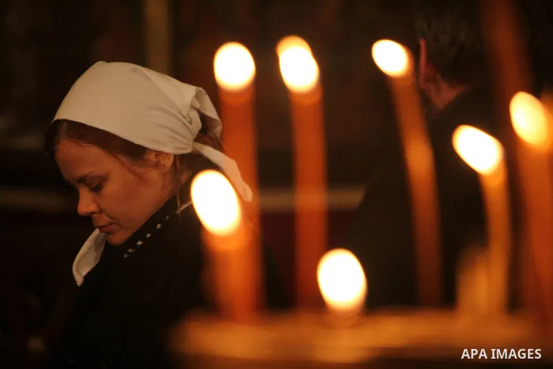 An Orthodox worshipper cries inside the Church of the Nativity, traditionally believed by Christians to be the birthplace of Jesus Christ, during Orthodox Christmas celebrations in the West Bank city of Bethlehem, late F...