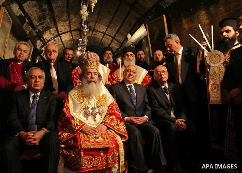 Palestinian Prime Minister Salam Fayyad attend the Christmas procession inside the Church of the Nativity in the West Bank town of Bethlehem January 7, 2012. Photo by Mustafa Abu Dayeh