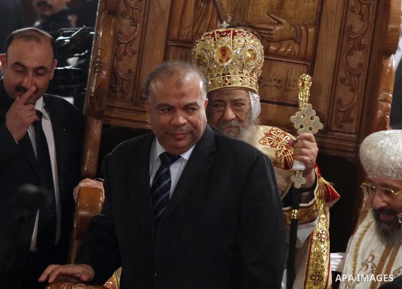 the party's Secretary General Saad al-Katatni, attend the Coptic Christmas eve mass at the main cathedral in Cairo January 6, 2012. Egypt's Christians are celebrating their first Christmas Mass after the public uprising...