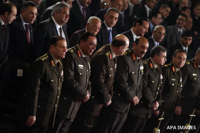 Egyptian potential presidential candidate Ahmed Shafik and General Sami Anan , Army chief of Staff and member of the SCAF at the Supreme Council of the Armed Forces, and other high-ranking military officials attend the C...