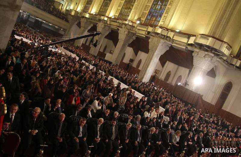 Egyptian Coptic Christians attend the Coptic Christmas midnight mass at Abbassiya Cathedral in Cairo on January 6, 2012. A massive plan to protect Egyptian churches swung into action ahead of the Christmas eve mass lead...