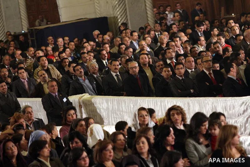 Egyptian Coptic Christians attend the Coptic Christmas midnight mass at Abbassiya Cathedral in Cairo on January 6, 2012. A massive plan to protect Egyptian churches swung into action ahead of the Christmas eve mass lead...