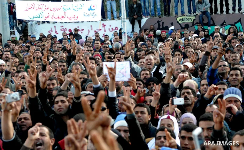 Tunisian Islamist Ennahdha Party supporters cheer as they greet of Palestinian Prime Minister in gaza strip, Ismail Haniya on January 7, 2012 in Tunis. Photo by Mohammed Al-Ostaz