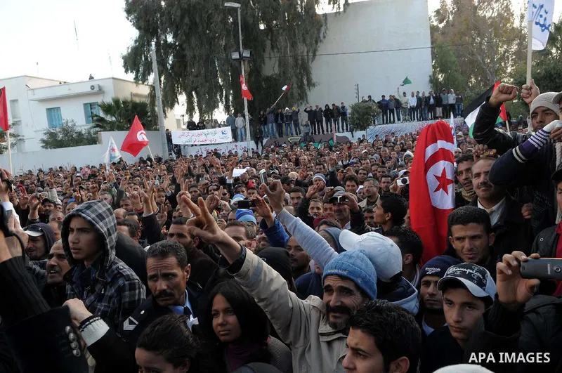 Tunisian Islamist Ennahdha Party supporters cheer as they greet of Palestinian Prime Minister in gaza strip, Ismail Haniya on January 7, 2012 in Tunis. Photo by Mohammed Al-Ostaz