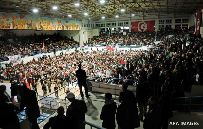 Tunisian Islamist Ennahdha Party supporters cheer as they greet of Palestinian Prime Minister in gaza strip, Ismail Haniya on January 7, 2012 in Tunis. Photo by Mohammed Al-Ostaz