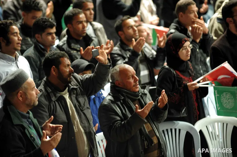 Tunisian Islamist Ennahdha Party supporters cheer as they greet of Palestinian Prime Minister in gaza strip, Ismail Haniya on January 7, 2012 in Tunis. Photo by Mohammed Al-Ostaz