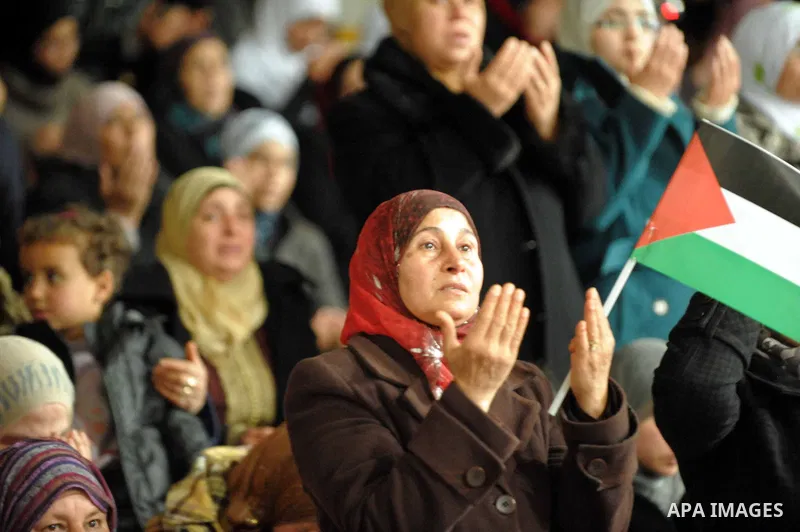 Tunisian Islamist Ennahdha Party supporters cheer as they greet of Palestinian Prime Minister in gaza strip, Ismail Haniya on January 7, 2012 in Tunis. Photo by Mohammed Al-Ostaz