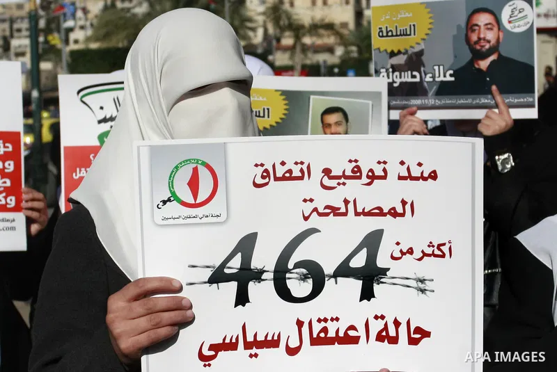 Palestinian Hamas supporters hold up pictures of relatives who were arrested and imprisoned for political reasons by Palestinian Authority security forces, during a protest in the West Bank city of Nablus, on Jan. 09, 20...
