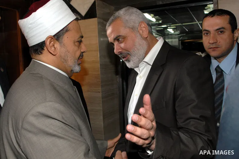 Palestinian Prime Minister in Gaza Strip, Ismail Haniyeh, meets with sheikh of al-Azhar Ahmed al-Tayyeb, the , during his visit in Cairo, Egypt, on Jan. 10, 2012. Photo by Mohammed Al-Ostaz