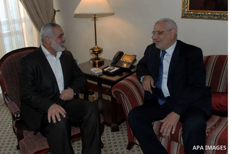 Palestinian Prime Minister in Gaza Strip, Ismail Haniyeh, meets with Abed el- Moneim Abu Fatouh , during his visit in Cairo, Egypt, on Jan. 10, 2012. Photo by Mohammed Al-Ostaz