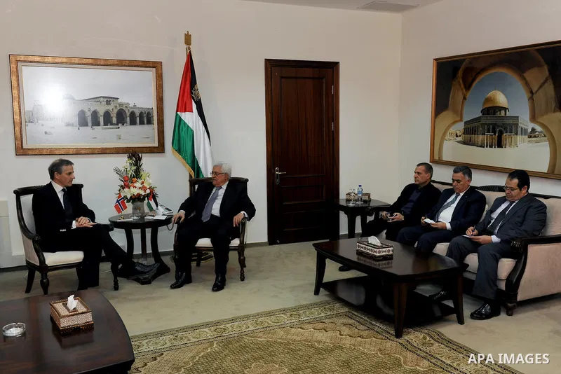 Palestinian President Mahmoud Abbas, right, and Norway's Foreign Minister Jonas Gahr Store meet in the West Bank city of Ramallah, Thursday, Jan. 12, 2012. Photo by Thaer Ghanaim